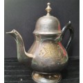 AN ANTIQUE SILVER PLATED TEA POT JUG SOLD AS IS
