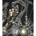 A VINTAGE JOBLOT SILVER TONE AND PLATED COSTUME NECKLACES SOLD AS IS