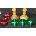 A GENUINE SET OF TWO PJ VAN RHEENEN STINK WOOD CANDLE STANDS AND A SET OF SIX MULTI COLOURED NAPKIN