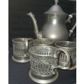 A VINTAGE TEA POT JUG ELECTRO PLATED SILVER AND SIX SILVER PLATED TEA GLASS HOLDERS