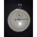 A vintage pocket timer watch missing the face glass , but in working condition sold as is
