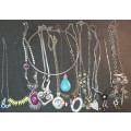 A BULK VINTAGE JOBLOT COSTUME NECKLACES AND PENDANTS SOLD AS IS