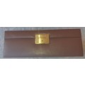 A NEAT BROWN LEATHER COVERED JEWELRY BOX IN GOOD CONDITON SOLD AS IS