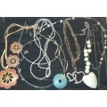 A COLLECTION OF VINTAGE COSTUME JEWELRY SOLD AS IS