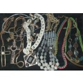 A VINTAGE COLLECTION OF COSTUME NECKLCES SOLD AS IS