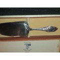 A RARE SILVER NICKLE PLATED CAKE CUTTER MADE IN HOLLAND SOLD AS IS