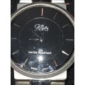AN 18KT WHITE GOLD PLATED ROYALTY SWISS MOVEMENT WRIST WATCH SOLD AS IS NOT TESTED