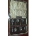 AN ANTIQUE EPNS TEASPOON SET IN ITS ORIGINAL CASE SOLD AS IS