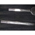TWO STAINLESS STEEL CAKE LIFTERS SOLD AS IS