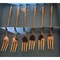 A COMPLETE SET GOLD PLATED COCKTAIL FORKS SOLD AS IS