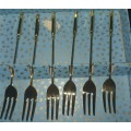 A COMPLETE SET GOLD PLATED COCKTAIL FORKS SOLD AS IS