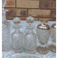 A VINTAGE COLLECTORS CRYSTAL GLASS BOTTLES AND CONTAINERS