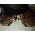 A RARE VINTAGE WOMANS BVLGARI SUNGLASSES SOLD AS IS