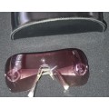 A VINTAGE WOMANS GEORGIO ARMANI SUNGLASSES SOLD AS IS