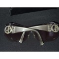 A VINTAGE WOMANS GEORGIO ARMANI SUNGLASSES SOLD AS IS