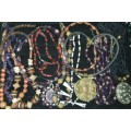 A JOBLOT COLLECTION VINTAGE COSTUME NECKLACES SOLD AS IS