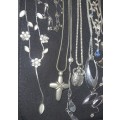 A bulk collection of silverplated and silver tone M&G designed necklaces and pendants