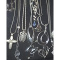 A bulk collection of silverplated and silver tone M&G designed necklaces and pendants