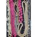 A VINTAGE COLLECTION OF COSTUME BEADED NECKLACES SOLD AS IS