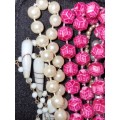 A VINTAGE COLLECTION OF COSTUME BEADED NECKLACES SOLD AS IS