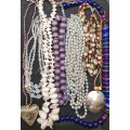 A VINTAGE COLLECTION JOBLOT OF BEADED COSTUME NECKLACES SOLD AS IS