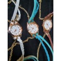 A WOMANS COSTUME SET OF 3 NECKLACES QUARTZ WATCHES SOLD AS IS NOT TESTED