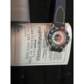 A VINTAGE WOMANS WATCH IN ITS ORIGONAL BOX AND HAS IST ORIGONAL CERTIFICATE SOLD AS IS