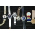 A MIXED VINTAGE JOBLOT WATCHES SOME MAY NEED BATTERIRES AND COVERS SOLD AS IS NOT TESTED