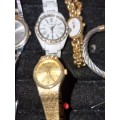 A COLLECTION OF WOMANS WATCHES SOLD AS IS NOT TESTED
