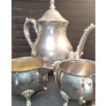 A VINTAGE SILVER-PLATED VICTORIAN STYLE TEA JUG, MILK AND SUGAR BOWL SET SOLD AS IS