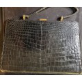 A genuine used black ostrich skin tote handbag