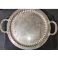 A VINTAGE ORNATELY ENGRAVED SILVER-PLATED SERVING TRAY SOLD AS IS