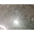 A VINTAGE ORNATELY ENGRAVED SILVER-PLATED SERVING TRAY SOLD AS IS