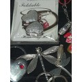 A JOBLOT VINTAGE AND MODERN CELLPHONE CHARMS AND KEYRINGS SOLD AS IS