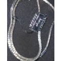 A collection of virtually brand new sterling silver clad necklaces sold as is