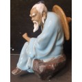 A HAKATA FIGURINE SOLD AS IS