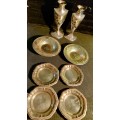 A collection of vintage utensils and a pair of silver-plated candle holders in good condition sold a