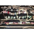 A BULK VINTAGE COLLECTION OF RARE QUALITY BANGLES AND BRACELETS SOLD AS IS