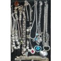 A QUALITY VINTAGE JOBLOT COSTUME SILVER PLATED AND STAINLESS STEEL NECKLACES AND PENDANTS