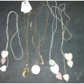 A COLLECTION OF SEA CORAL PENDANT NECKLACES SOLD AS IS