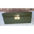A VINTAGE GREEN LEATHER WITH A GOLD PLATED LETTER M JEWELRY BOX SOLD AS IS