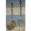 A SET OF ORNAMENTAL BRASS LADEL AND FORK MADE IN ISREAL LENGTH 35 TO 40 CENTIMETERS SOLD AS IS