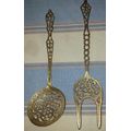 A SET OF ORNAMENTAL BRASS LADEL AND FORK MADE IN ISREAL LENGTH 35 TO 40 CENTIMETERS SOLD AS IS