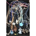 A BULK COLLECTION OF LEATHER ROPE COSTUME NECKLACES SOLD AS IS