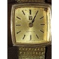 AN ANTIQUE TISSOT SAPHIR GOLD PLATED WITH THE CRYSTAL GLASS SOLD AS IS NOT TESTED