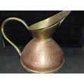 A VINTAGE BRONZE AND COPPER URN OR WATER JUG,