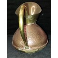 A VINTAGE BRONZE AND COPPER URN OR WATER JUG,