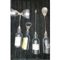 A COLLECTION OF DECORATIVE BAR UTENSILS SOLD AS IS