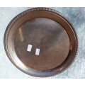A VINTAGE ROUND SILVERPLATED SERVING TRAY SOLD AS IS