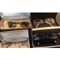 A COLLECTION OF POLICE VERSACE AND BVLGARI SPECTACLES SOLD AS IS